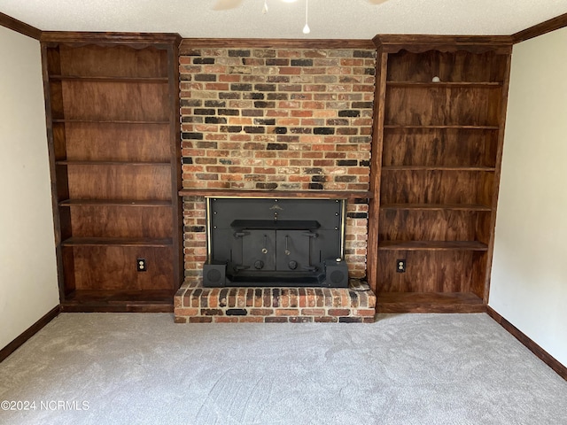 unfurnished living room featuring a textured ceiling, a fireplace, built in features, baseboards, and carpet