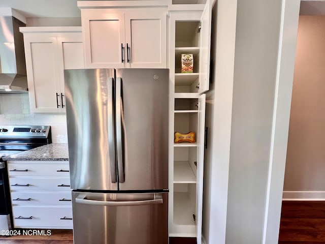 3701 Greystone Dr, Rocky Mount, NC 27804 - kitchen featuring white cabinetry, wall chimney range hood, backsplash, and appliances with stainless steel finishes