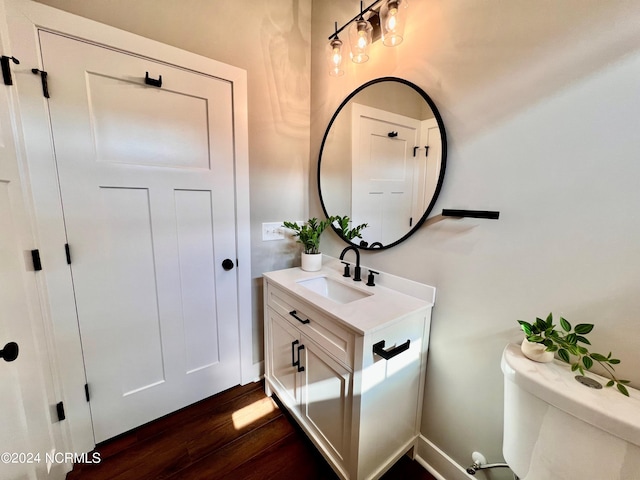3701 Greystone Dr, Rocky Mount, NC 27804 - bathroom featuring toilet, vanity, and wood finished floors