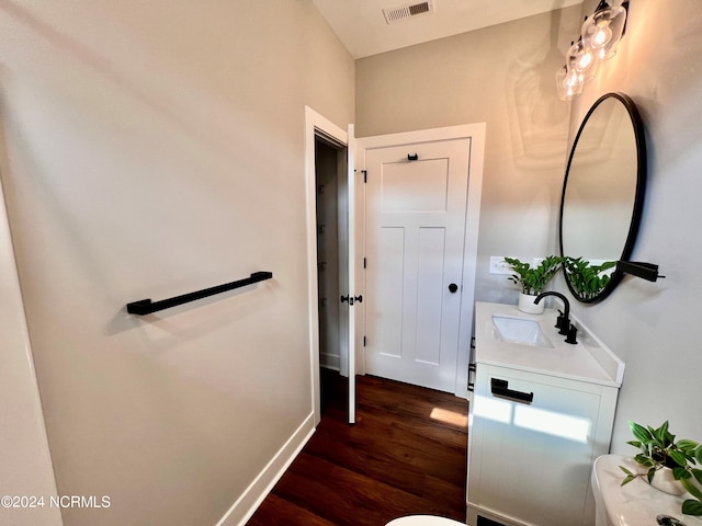 3701 Greystone Dr, Rocky Mount, NC 27804 - bathroom featuring visible vents, baseboards, vanity, and wood finished floors