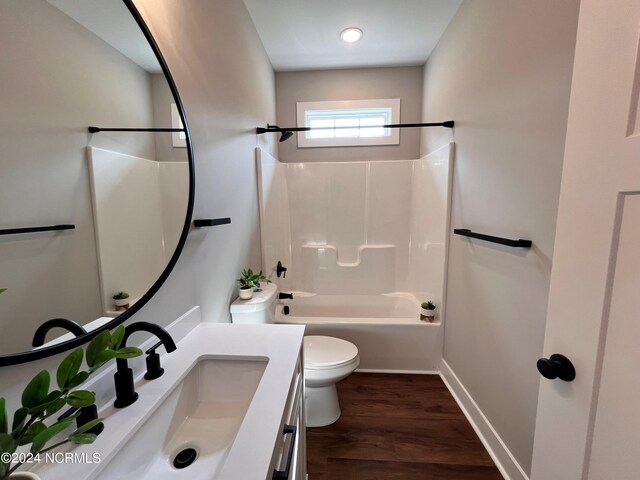 3701 Greystone Dr, Rocky Mount, NC 27804 - bathroom with baseboards, toilet, vanity, wood finished floors, and shower / bathtub combination