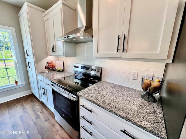3701 Greystone Dr, Rocky Mount, NC 27804 - kitchen featuring white cabinets, wall chimney range hood, dark wood-style floors, stainless steel range with electric cooktop, and light stone countertops