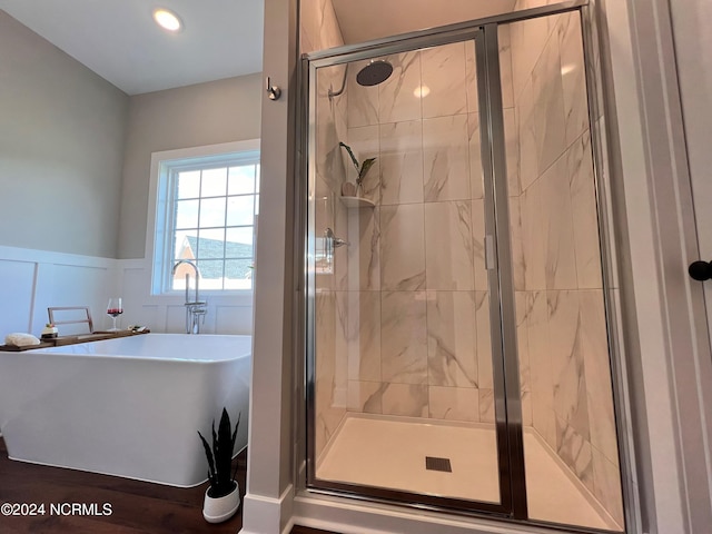 3701 Greystone Dr, Rocky Mount, NC 27804 - full bathroom with a decorative wall, wainscoting, a stall shower, and a soaking tub