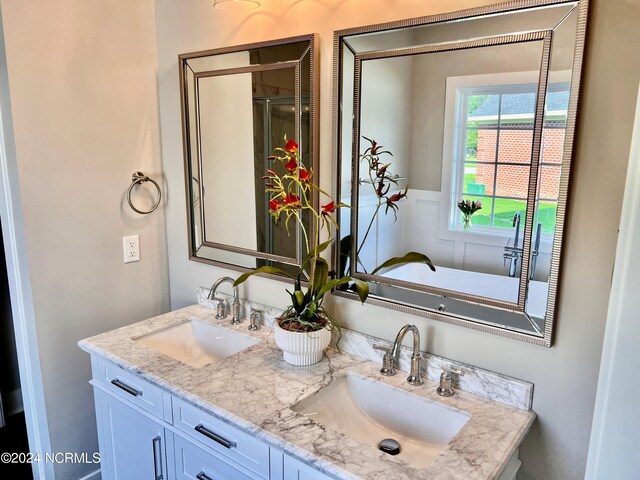 3701 Greystone Dr, Rocky Mount, NC 27804 - full bathroom featuring double vanity, a sink, and a wainscoted wall