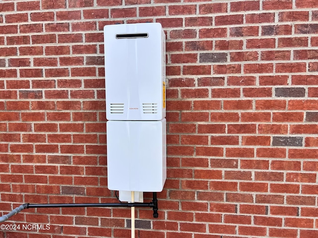 3701 Greystone Dr, Rocky Mount, NC 27804 - details with brick siding and water heater