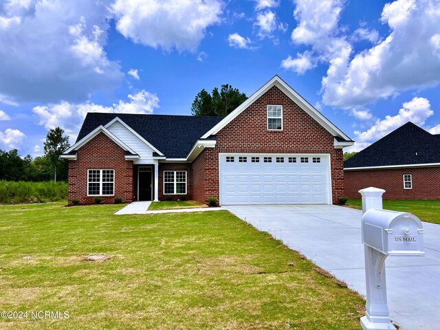 3701 Greystone Dr, Rocky Mount, NC 27804 - view of front of property with driveway, a front yard, and brick siding