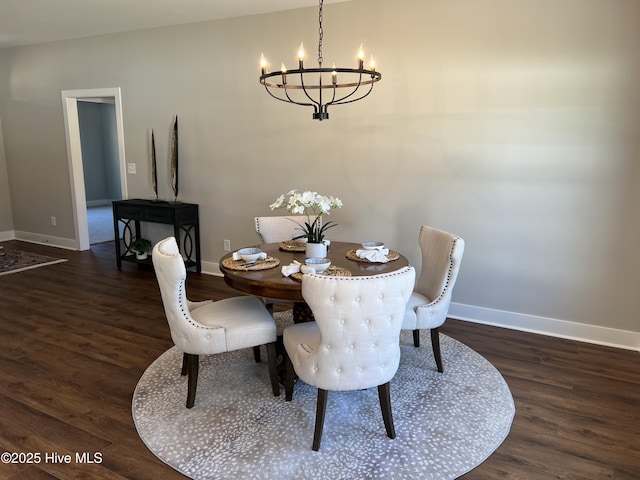 3701 Greystone Dr, Rocky Mount, NC 27804 - dining space featuring baseboards, a chandelier, and wood finished floors
