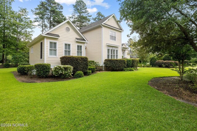 view of home's exterior featuring a lawn