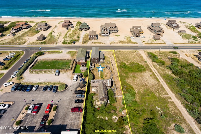 drone / aerial view with a view of the beach and a water view