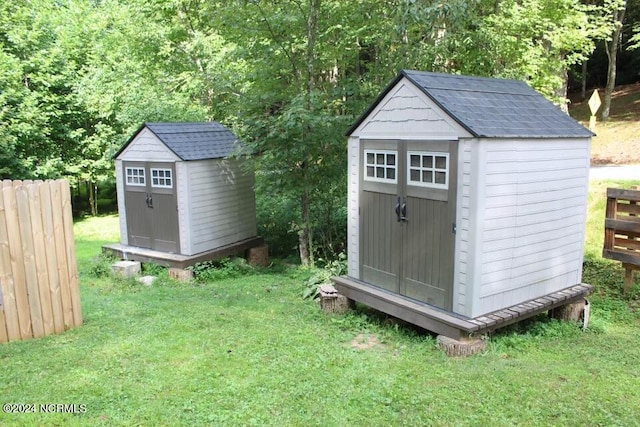 view of outdoor structure featuring a lawn