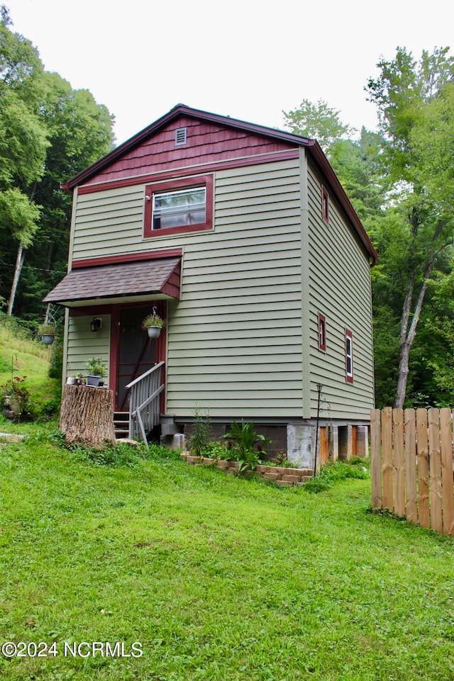 exterior space featuring a front lawn