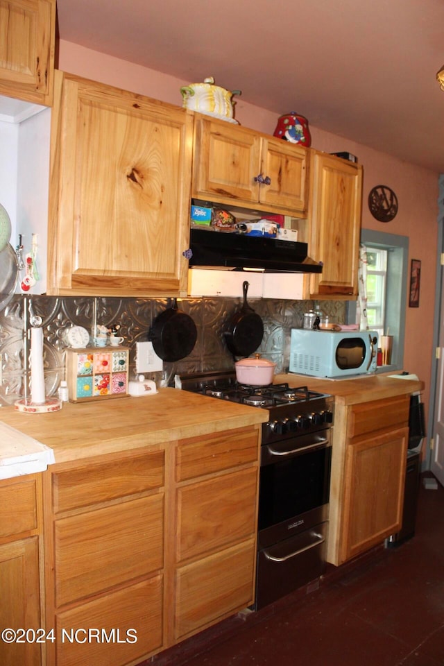 kitchen with tasteful backsplash, range with gas cooktop, butcher block counters, and light brown cabinetry