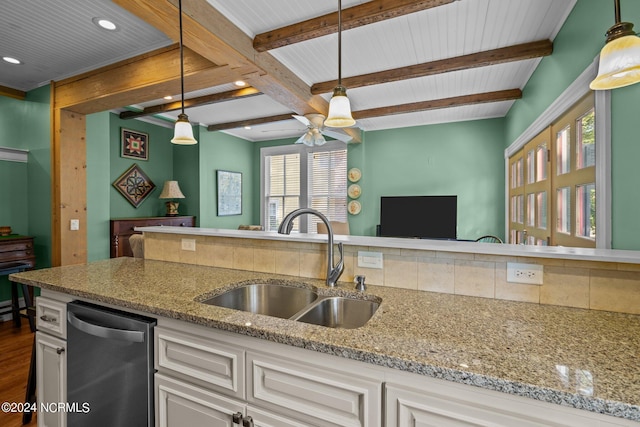 kitchen featuring light stone counters, a sink, open floor plan, beam ceiling, and dishwasher