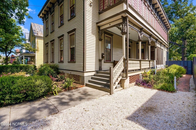 doorway to property featuring covered porch