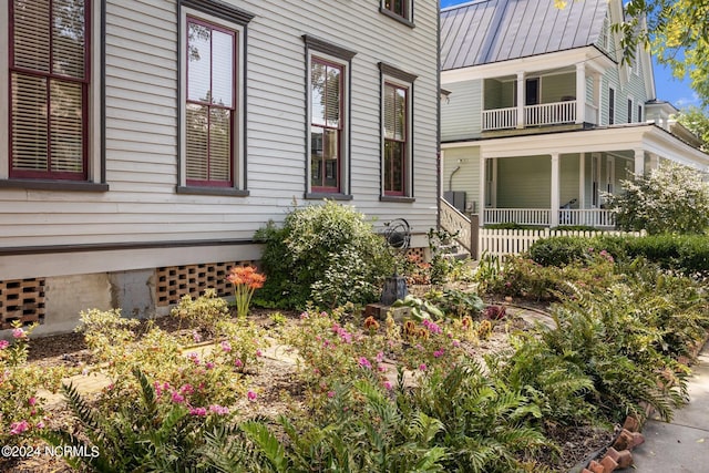 exterior space featuring a standing seam roof and metal roof