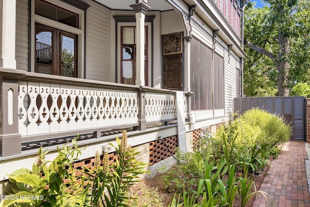 view of side of home with a porch