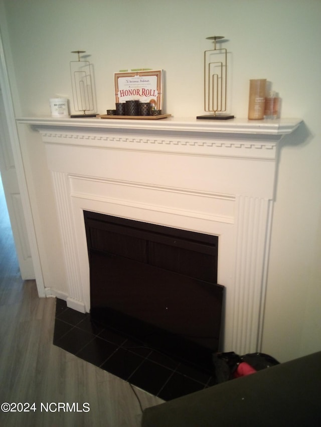 interior details featuring hardwood / wood-style flooring