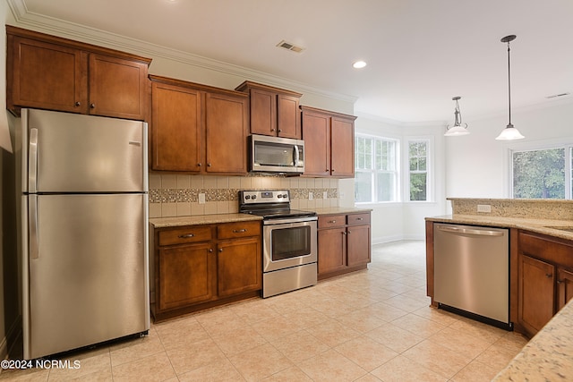 kitchen with backsplash, stainless steel appliances, light stone countertops, light tile patterned floors, and hanging light fixtures