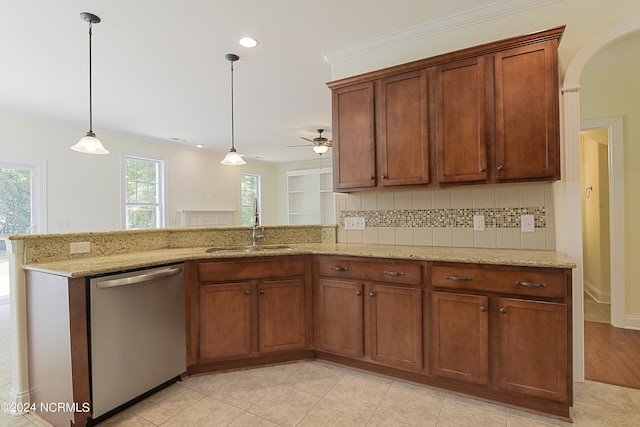 kitchen featuring light wood-type flooring, stainless steel dishwasher, tasteful backsplash, light stone counters, and decorative light fixtures