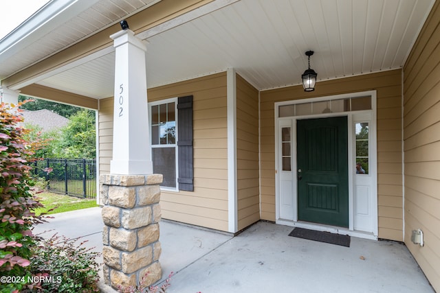 doorway to property featuring a porch