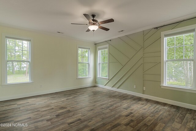 empty room featuring hardwood / wood-style floors and plenty of natural light