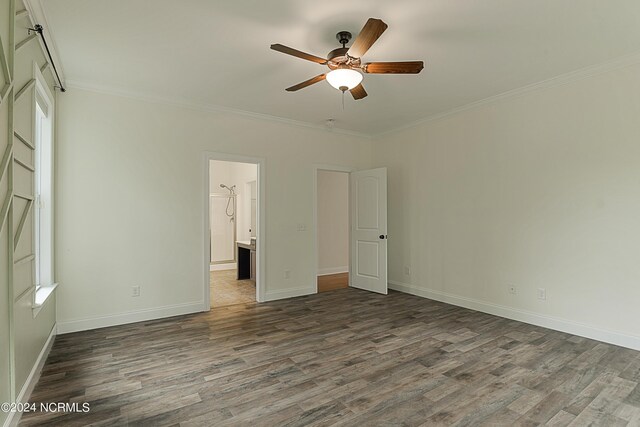 spare room featuring hardwood / wood-style floors, crown molding, and ceiling fan