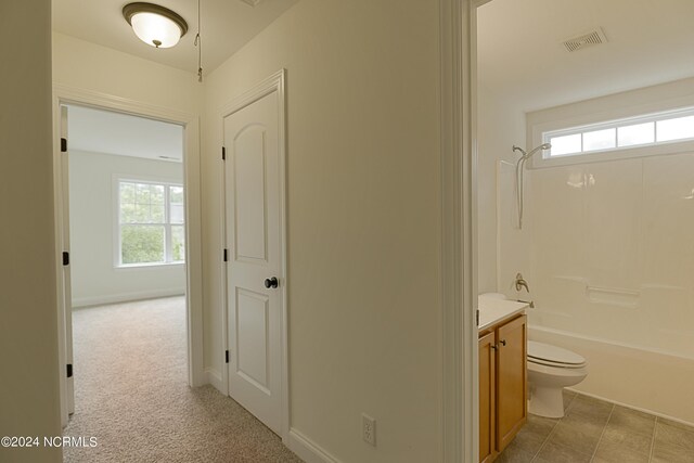 full bathroom with tile patterned flooring, toilet, vanity, and bathtub / shower combination