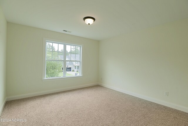 empty room featuring carpet floors