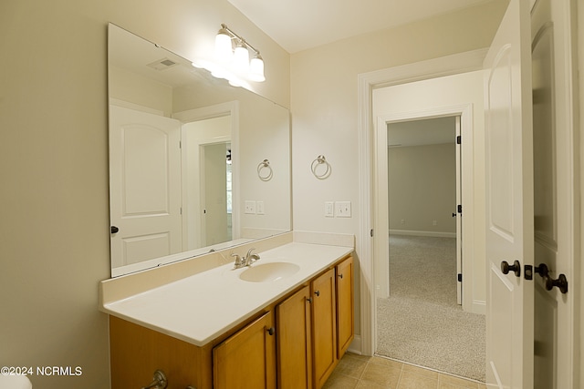 bathroom with tile patterned flooring and vanity