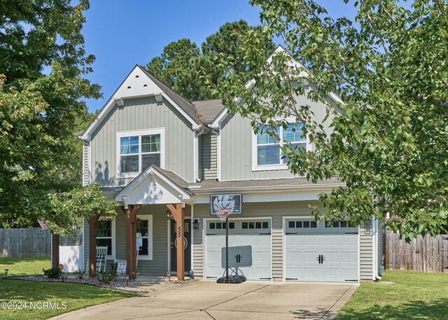 view of front of home with a garage and a front yard