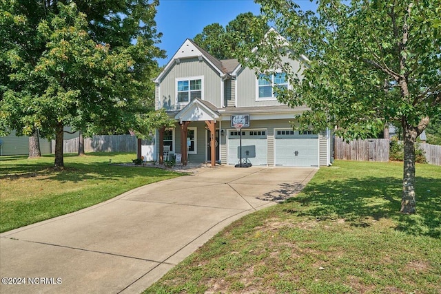 view of front of home with a garage and a front lawn