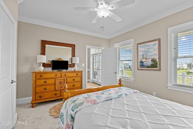 bedroom featuring light colored carpet, ceiling fan, and ornamental molding