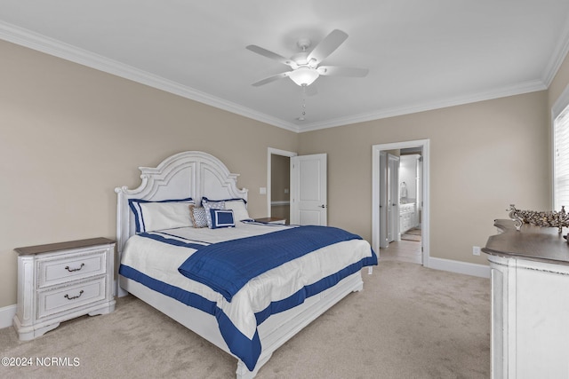 bedroom featuring light colored carpet, ornamental molding, ceiling fan, ensuite bath, and baseboards