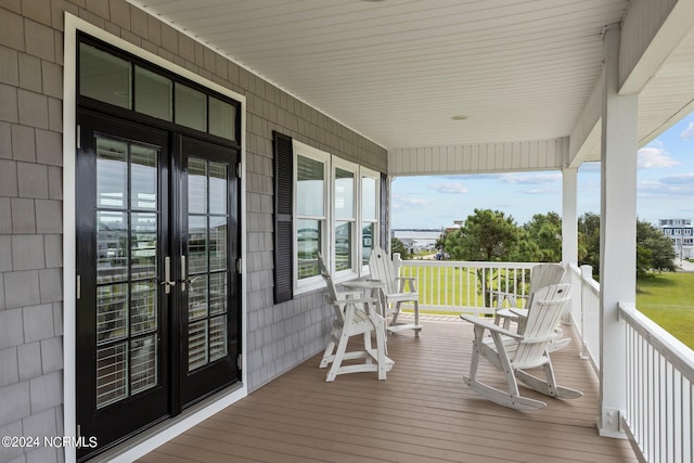 deck featuring covered porch and french doors