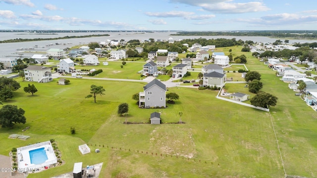 bird's eye view featuring a water view and a residential view