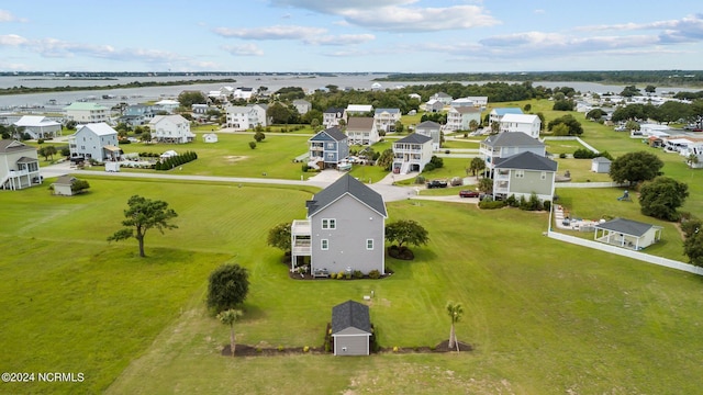 bird's eye view with a water view and a residential view