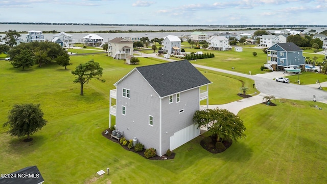 bird's eye view featuring a water view and a residential view