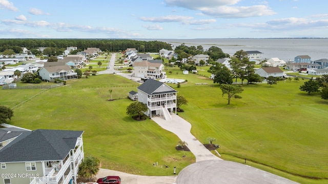 birds eye view of property featuring a residential view and a water view