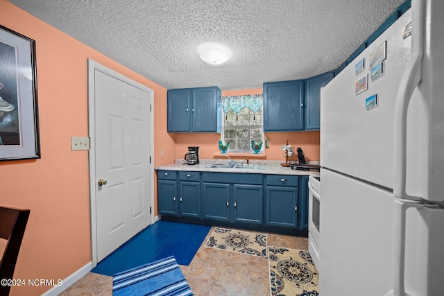 kitchen with a textured ceiling, light countertops, white appliances, and blue cabinetry