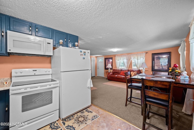 kitchen featuring a textured ceiling, white appliances, light colored carpet, and blue cabinetry