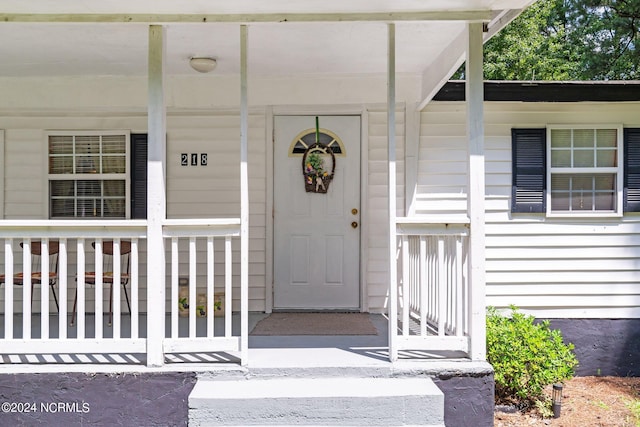 entrance to property with covered porch