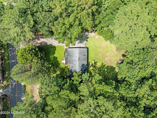 drone / aerial view featuring a forest view