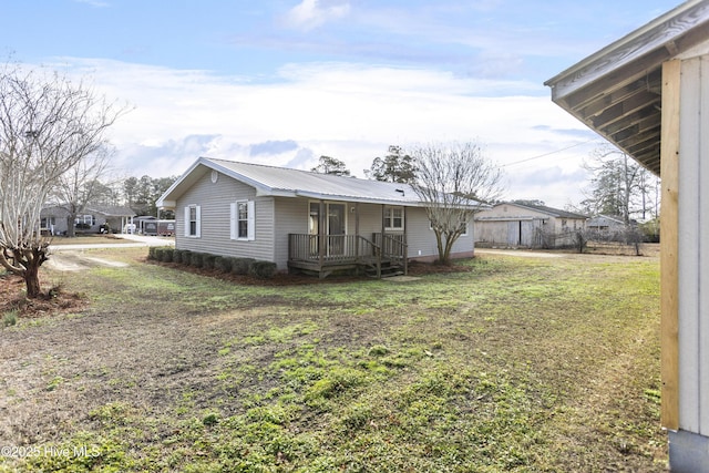 back of property with a yard