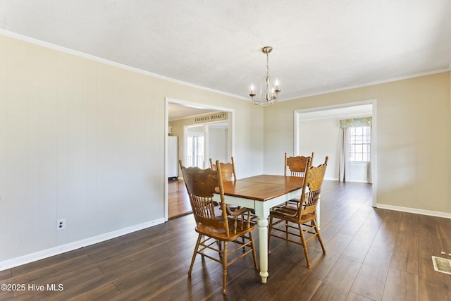 dining area featuring dark hardwood / wood-style flooring and ornamental molding