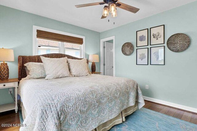 bedroom featuring dark hardwood / wood-style floors and ceiling fan