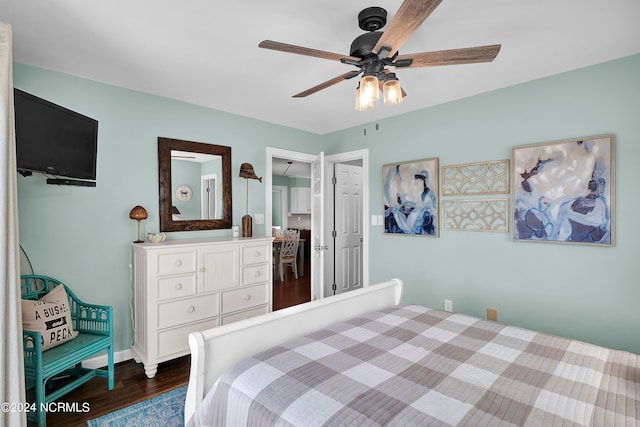 bedroom with a closet, dark hardwood / wood-style floors, and ceiling fan