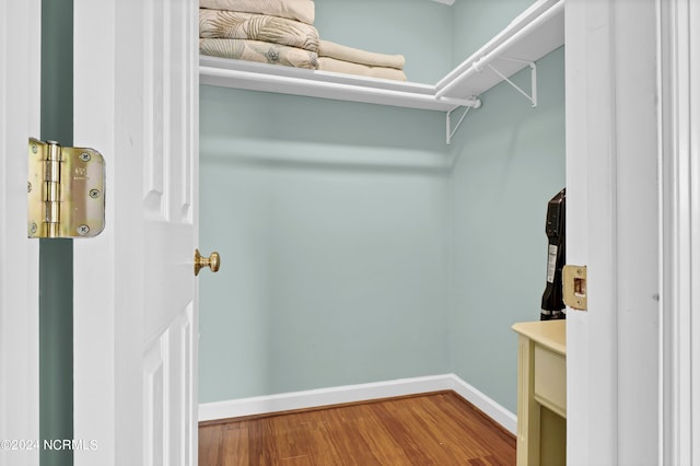 walk in closet featuring wood-type flooring