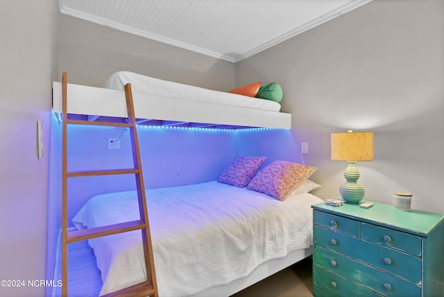 bedroom with ornamental molding