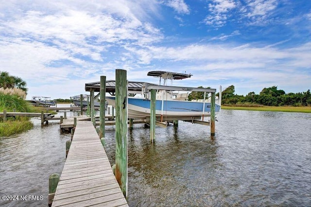 dock area featuring a water view and boat lift