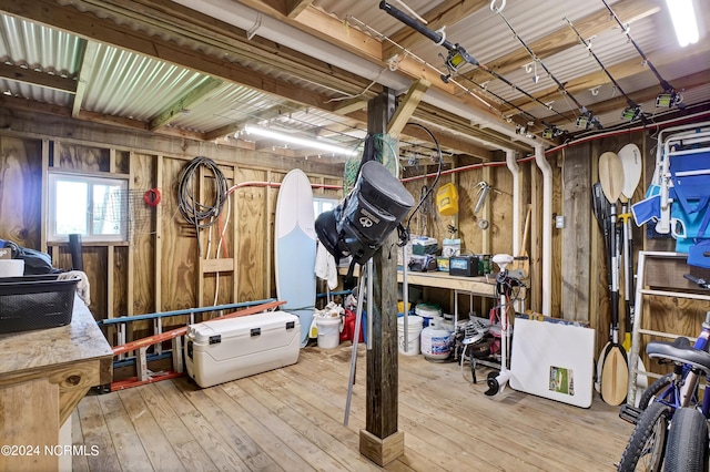 interior space featuring hardwood / wood-style flooring and wooden walls